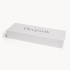 Experience deeper rest with our Deepsilk Sleeping Mask, crafted from the finest 25-momme charmeuse woven mulberry silk. This mask features our exclusive sericin-enriched Deepsilk™, designed to moisturise and protect your skin as you sleep. The unique “silk puff” design around the eyes ensures a gentle touch, minimising skin marks and preventing wrinkles. This mask is designed to relieve eye pressure, foster extended REM sleep cycles, and reduce puffiness for a refreshed look. The triple-layer black silk construction blocks out light completely, while the silk’s hypoallergenic and breathable qualities keep your skin cool and free from irritation all night long. An adjustable elastic band at the nape ensures a secure, hair-friendly fit, avoiding the discomfort of Velcro. Whether you sleep on Rem Sleep Cycle, Eye Pressure, Puff Design, Skin Marks, Rem Sleep, Sleeping Mask, Gentle Touch, Prevent Wrinkles, Sleep Mask