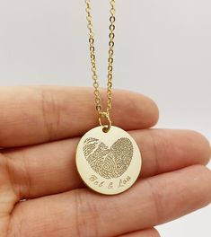 ACTUAL FINGERPRINT &HANDWRITING NECKLACE This necklace is personalized with actual fingerprint and handwriting you provide us.It is good for Christmas, Anniversary ,Birthday or Wedding gift. I T E M ∙ D E T A I L S 1. MATERIAL: GOLD-FILLED (hypoallergenic)    -14K Gold fill is a pressure-bonded layer of gold that has 100 times more gold than plated jewelry. It is durable, won't chip or flake, is tarnish-resistant, and is a great alternative to "karat" gold that is reasonably priced. Looks great and if taken care of should last for many years.  HIGH QUALITY 925 STERLING SILVER     -We use 925 Sterling Silver, which requires polishing from time to time from oxidation. You can easily restore the silver back to shine with a polishing cloth or use a polishing lotion for that extra shine. 2. Cha Fingerprint Necklace, Baby Footprint, Baby Handprint, Handwriting Necklace, Baby Footprints, Pet Memorial Gifts, Custom Necklace, Memorial Gifts, Name Necklace