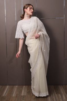 Off-white chinon saree with floral, thread and sequins hand embroidery. Comes with a padded blouse. - Aza Fashions White Chinon Traditional Wear For Navratri, Elegant White Blouse For Diwali, White Silk Pre-draped Saree For Festivals, White Organza Pre-draped Saree For Eid, White Cutdana Sharara In Tissue Silk, White Silk Saree With Resham Embroidery, White Silk Choli With Resham Embroidery, White Silk Pre-draped Saree With Zari Work, White Tissue Silk Traditional Wear For Party