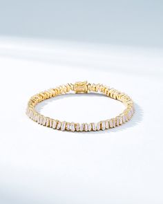 Suzanne loves creating timeless jewelry pieces, but with a modern twist. This beautiful tennis bracelet incorporates our beloved baguette white diamonds unevenly set all the way around, for a unique yet radiant look. We love this piece for its seamless design and everyday wearability. The perfect baguette tennis bracelet to instantly elevate any outfit, casual or formal. Details 18k yellow gold, white gold or rose gold 4.00 carats of white diamond baguettes Bracelet measures 7" inches in length Baguette Bracelet, Diamonds Bracelet, Diamond Tennis Bracelet, Box Clasp, Tennis Necklace, Tennis Bracelet Diamond, Timeless Jewelry, Baguette Diamond, Tennis Bracelet