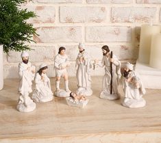 a group of figurines sitting on top of a wooden table