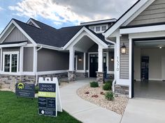 a home for sale in the suburbs of denver, co with a sign out front