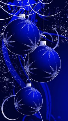 blue christmas balls hanging from strings against a dark background with swirls and snowflakes