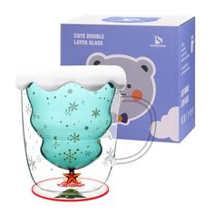 a glass cup with a bear design on the side and a box behind it that says cute bubble layer glasses