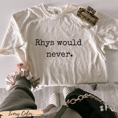 Rhys Would Never  I ACOTAR shirt I Sarah J Maas Licensed SJM merch I Feyre and Rhysand I Bookish Fandom 🌙 ⭐ Officially Licensed Sarah J. Maas Merchandise ACOTAR Collection ⭐ 🌙  Rhys Would Never ACOTAR merch for all SJM fans. Rhys Would Never design for Comfort colors graphic shirt, a fully customizable tee made 100% with ring-spun cotton. The soft-washed, garment-dyed fabric brings extra coziness to your wardrobe while the relaxed fit makes it an excellent daily choice. The double-needle stitching throughout the tee makes it highly durable while the lack of side-seams helps the shirt retain its tubular shape. .: 100% ring-spun cotton .: Medium fabric (6.1 oz/yd² (206.8 g/m .: Relaxed fit .: Sewn-in twill label From A Court of Thorns and Roses, by Sarah J. Maas, © 2015. Artwork by Veselin Acotar Shirt Design, Book Cricut Ideas, Acotar Shirt Ideas, Bookish Merch Ideas, Acotar Apparel, Acotar Cricut Ideas, Acotar Clothing, Feyre Outfit, Acotar Clothes