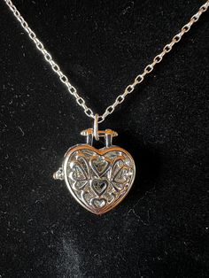 Silver heart locket pendant on 16 inch .925 sterling silver roll chain Nickel Free Heart Shaped White Gold Jewelry, Silver Locket Charm Necklace With Medallion, Silver Round Locket Heart Necklace, Double Heart Locket Necklace In White Gold, Silver Round Locket Necklace For Valentine's Day, Silver Locket Necklace For Valentine's Day, Double Heart White Gold Locket Necklace, Silver Locket For Valentine's Day, Silver Medallion Necklace For Anniversary Gift