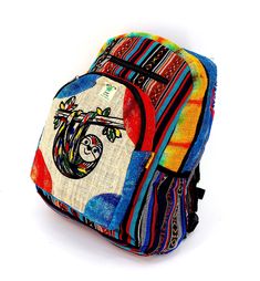 A versatile and beautiful Sloth Print Hemp Backpack made with 100 percent natural THC-free Himalaya hemp. Stitched and assembled by the most talented artisans in Nepal. The product is double stitched with the highest quality Himalaya hemp. The product consists of double zippers and completely adjustable shoulder straps, ensuring that the bag is one size fits all the product. This double-strapped backpack is a product that consists of various compartments which can be of multiple different uses m Bohemian Multicolor Backpack For Festival, Bohemian Handmade Backpack, Handmade Bohemian Rectangular Backpack, Eco-friendly Multicolor School Backpack, Himalayan Hemp Bag, Himalayan Hemp Backpack, Eco-friendly Multicolor Travel Backpack, Leaf Symbol, Eco-friendly Multicolor Backpack