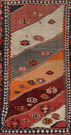 an old rug with different colors and patterns