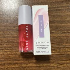 Brand New, Authentic Fenty Cherry Treat Conditioning, Strengthening Lip Oil. This Lip Oil Treatment Smells So Delicious Feels Amazing Against Your Lips And Is Perfect To Wear Alone And Or On Top Of Your Favorite Lipstick Glides On Smoothly Fenty Beauty Lip Oil Cherry, Fenty Cherry Lip Oil, Fenty Beauty Lip Oil, Fenty Lip Oil, Fenty Beauty Lip Gloss, Lips Products, Fenty Beauty Makeup, Obx Dr, Essence Makeup