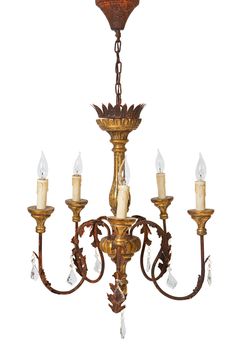 an antique chandelier with five candles hanging from the bottom and one light on top