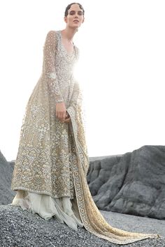 Hand Embellished Long Sleeve Lehenga For Wedding, Elegant Wedding Dress With Sheer Dupatta, Glamorous Net Lehenga For Wedding, Elegant Beige Organza Lehenga, Beige Wedding Dress With Intricate Embroidery, Elegant Embellished Net Sharara, Elegant Designer Lace Dresses, Beige Dress With Intricate Embroidery For Reception, Glamorous Beige Wedding Gown