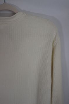 Everyday and simple cream ribbed knit top with long sleeves, cropped fit, and front pocket details details & fit: fits true to size. 64% cotton, 30% polyester, 6% spandex measurements: small: bust 36"/ waist 36"/ length 17.5" medium: bust 38"/ waist 38"/ length 18" large: bust 40"/ waist 40"/ length 18.5" model details: model is 5'7" and wearing size small