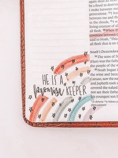 an open bible with the word he is a rainbow keeper written in cursive writing