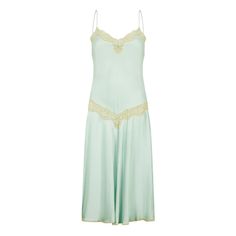 This elegant slip dress is cut from beautiful seafoam green silk and trimmed with pale off-white lace. Created by luxury lingerie label Jenny Dobell in the 1980s, it draws on classic 1920s’ silhouettes. The flared skirt kicks out as the wearer moves and delicate spaghetti straps support the lace-detailed, sweetheart neckline. A pretty, coordinating seafoam bow is placed in the middle of the chest and a panel of sheer lace encircles the waist. Modern equivalents are rarely made as well as this pi Vintage Silk Slip Dress With Spaghetti Straps, Elegant Green Slip Dress For Daywear, Vintage Silk Slip Dress For Wedding Night, Vintage Silk Slip Dress With Lace Trim, Vintage Lace Slip Dress For Evening, Vintage Lace Evening Slip Dress, Elegant Slip Dress, Mint Dress, Lace Nightgown