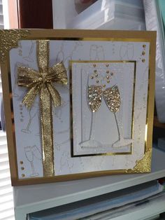 a card with two champagne glasses on it