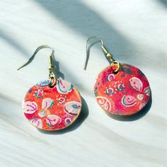 These earrings are one of a kind hand painted paper earrings with cute flower embelishments.  They have a little golden touch around the edges.  They are coated with quality UV resin. Very light weight!  Earrings come with high quality nickel free hypoallergenic earring hooks. Colorful Handmade Flower Earrings Gift, Colorful Handmade Flower Earrings For Gift, Handmade Colorful Flower Earrings For Gift, Artsy Multicolor Flower Earrings, Multicolor Flower-shaped Artsy Earrings, Red Hand-painted Flower Earrings For Gifts, Colorful Flower Drop Earrings As Gift, Colorful Flower Drop Earrings Gift, Colorful Flower Drop Earrings For Gifts