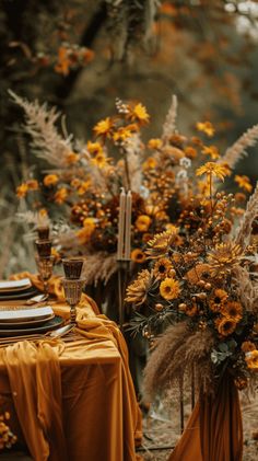 the table is set with yellow cloths and flowers