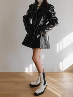 A stunning vegan leather jacket style dress that mimics a long blazer. Classic silhouette, oversized collar and button through front. Made from 100% quality PU. Model is in MINUSEY S. ✔️ Free worldwide express shipping over $100✔️ Loved by 6,500+ customers✔️ Limited edition collections, maximum style⠀⠀⠀⠀⠀⠀⠀⠀⠀Stay ahead of the trend with can’t-find-anywhere-else staples. Your closet will thank you 💕* MINUSEY S = EU 34, US 2* MINUSEY M = EU 36, US 4* 100% PU Leather* Dry clean* Made in Korea - Model Height: 172cm/5'7" (US 2, EU 34) Spring Long Sleeve Leather Jacket For Evening, Structured Single Breasted Outerwear For Party, Spring Leather Jacket With Lapel Collar For Night Out, Chic Long Coat Leather Jacket For Formal Occasions, Chic Long Leather Jacket For Formal Occasions, Chic Formal Long Leather Jacket, Sleek Fall Blazer Dress For Workwear, Chic Single Breasted Leather Jacket, Chic Single-breasted Leather Jacket