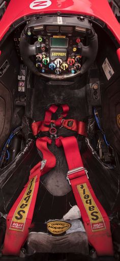 the inside of a race car with steerings and harnesses