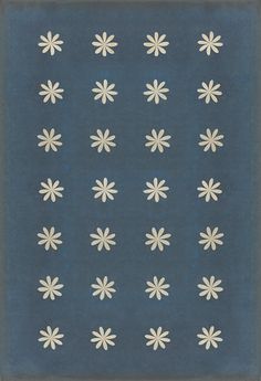 a blue rug with white flowers on it