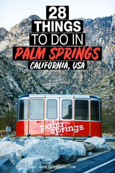 a red and white train traveling down tracks next to mountains with text overlay that reads 28 things to do in palm springs, california, usa