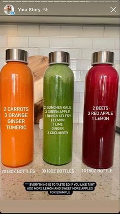 three different types of juice bottles sitting on top of a counter