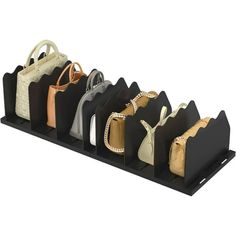 six purses are lined up on a black holder with handles and sides that match the color of each bag