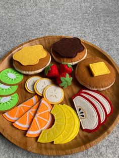 a wooden plate topped with different types of food