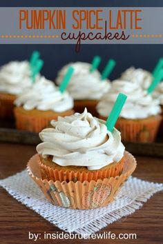 pumpkin spice latte cupcakes with white frosting and green plastic straws