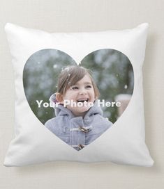 a white pillow with a heart shaped photo on it