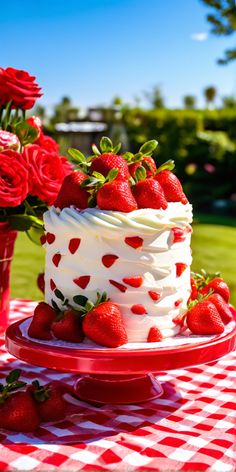 there is a cake with strawberries on the table