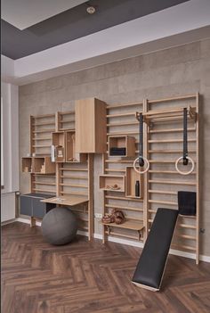 a room with wooden shelves and exercise equipment