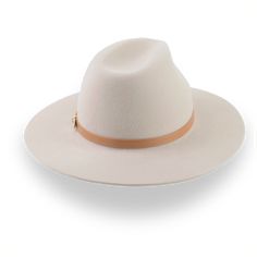 Description Materials Craftsmanship Hat Care Shipping Returns Product Description An Elegant Beige Wide Brim Rancher Hat Step up your style with the Solstice, a beige wide brim rancher hat handcrafted from premium rabbit fur felt. Designed for both elegance and durability, this hat features a smooth finish and a chic leather hat belt for a refined look. Custom-made to fit your exact head size, the Solstice ensures comfort and personalization with various color options. Delivered with a protectiv Wide Brim Fedora Women, Homburg Hat, Fedora Women, Wide Brim Felt Hat, Outdoor Hut, Gambler Hat, Mens Hats Fashion, Fedora Hat Men, Homburg