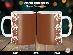 two coffee mugs with reindeer heads on them