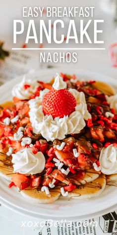 pancakes with whipped cream and strawberries on top