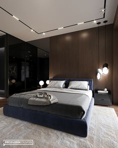 a large bed sitting in the middle of a bedroom next to a wall mounted mirror