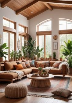 a living room filled with lots of furniture and plants on top of it's walls