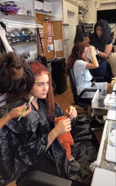 a group of women getting their hair done in a salon