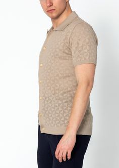 Introducing our Geometric Crochet Knit Polo, a sophisticated and stylish addition to your wardrobe. Crafted from high-quality crochet knit fabric, this polo shirt features a unique geometric pattern that adds a touch of modern flair. The crochet knit construction provides breathability and texture, making it ideal for warmer weather. The polo collar adds a classic touch, while the short sleeves offer comfort and versatility. With its tailored fit and attention to detail, this polo shirt is perfe Jacquard Knit Collared Top, Collared Jacquard Knit Top, Beige Jacquard Knit Top, Fitted Knit Polo Sweater With Collar, Fitted Knit Polo Sweater, Fitted Knit Collared Polo Sweater, Fitted Collared Knitted Sweater, Fitted Collared Pointelle Knit Tops, Fitted Textured Knit Polo Sweater With Polo Collar