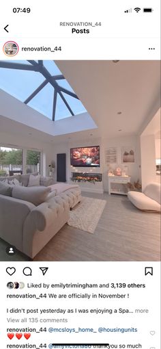 an instagramted photo of a living room with skylights on the ceiling and couches