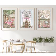 three framed pictures hang on the wall above a table