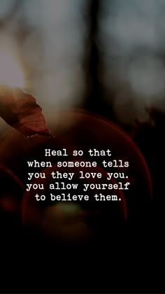 a leaf with the words heal so that when someone tells you they love you, you allow yourself to believe them