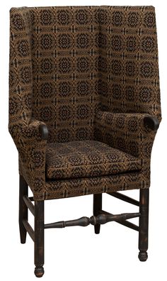 a brown and black patterned chair on a white background