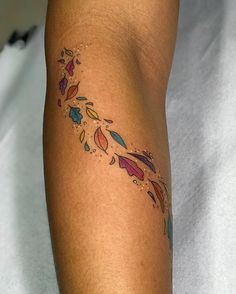 a woman's leg with tattoos on it