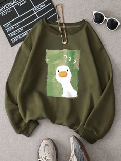 Introducing our Quirky and Cute sweatshirt, featuring a playful cartoon duck print. Made for women who want to add a touch of whimsy to their wardrobe, this sweatshirt is both fun and fashionable. Stay warm and stylish with our unique and cozy design. Color : Army Green Style : Casual Pattern Type : Cartoon Type : Pullovers Neckline : Round Neck Sleeve Length : Wrist-Length Sleeve Sleeve Type : Drop Shoulder Length : Regular Fit Type : Loose Fabric : Slight Stretch Material : Fabric Composition Over Size Sweatshirt, Cute Clothes Ideas, Cute Sweatshirts Outfits, Duck Clothing, Duck Outfit, Duck Clothes, Duck Sweatshirt, Duck Stuff, Shein Clothes