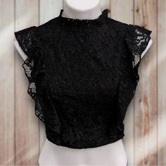 Majorelle Lace Ruffle Black Crop Top New Without Tags. Size Small. Features: Lace Ruffle Details Along The Sides Tie Closure Keyhole In Back Side Hidden Zip Down Closure. Hand Wash Cold, Flat To Dry 100% Poly Measurements: Pit To Pit Measures Approximately 17 In Shoulder-To-Base Measures Approximately 16 In Feel Free To Make Me Any Offer! I Will Always Accept Or Counter. Bundle Items To Get An Even Better Deal. Thank You For Browsing! Fitted Lace Crop Top With Ruffles, Elegant Black Crop Top With Lace Trim, Elegant Black Lace Trim Crop Top, Chic Evening Lace Crop Top, Elegant Lace Trim Crop Top For Party, Black Fitted Lace Top With Ruffles, Fitted Black Lace Top With Ruffles, Black Lace Trim Crop Top For Party, Chic Crop Top With Lace Trim For Night Out