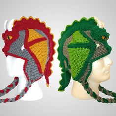 two crocheted hats with braids on top of each other, one in green and the other in red