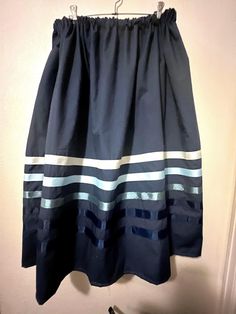 Ribbon skirt - Navy blue with blue ombre' ribbons Ribbon Skirt -Authentic Native American design for Pow Wow and Native American dances.  Skirt has an elastic waist that gives it the elusion of an A-line skirt.  Most skirts are 100% cotton or primarily cotton.  Skirt is meant to be a mid-calf-length skirt and is typically 31 - 32 inches. Skirt length may be adjusted, if it needs to be longer please choose the the long skirt option. If you do not find it on the LONG skirt post please message me for instructions.  PLEASE CHOOSE YOUR SIZE BELOW!!  *I ship all orders using Priority Mail with USPS. You can change that shipping on your own but it will change the shipping from free to paid and you will be responsible for paying the shipping.  **Select rush shipping if your skirt needs to moved to Blue Full Skirt With Elastic Waistband, Elegant Blue Skirt With Elastic Waistband, Ribbon Skirt, Rainbow Skirt, Ribbon Skirts, Navy Blue Skirt, Native American Design, Sewing Skirts