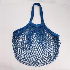 a blue net bag hanging on the wall