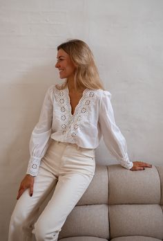 Elevate your style with our ecru v-neck shirt featuring intricate embroideries at the wrists and collar. Comfortable long sleeves, unlined for a chic look. Our model wears the Beige Solan Jeans Sizes: S-M / M-L S-M: Length 21.65 in - Width 19.29 in M-L: Length 22.83 in - Width 20.47 in Handwash. Women's Spring Fashion, Parisian Women, Chic Look, Neck Shirt, Spring Fashion, Fitness Models, Jeans Size, Ruby, Fashion Clothing